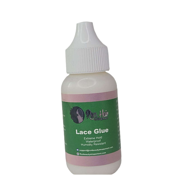 Bottle of lace glue with a green label on a white background