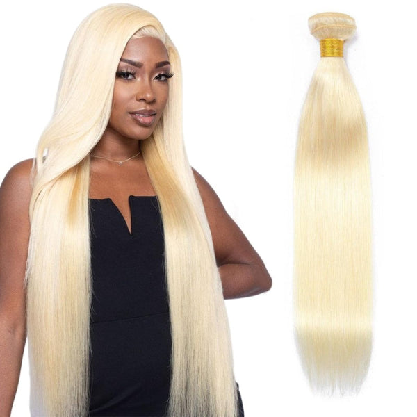Woman with long blonde hair and a blonde hair extension on a white background