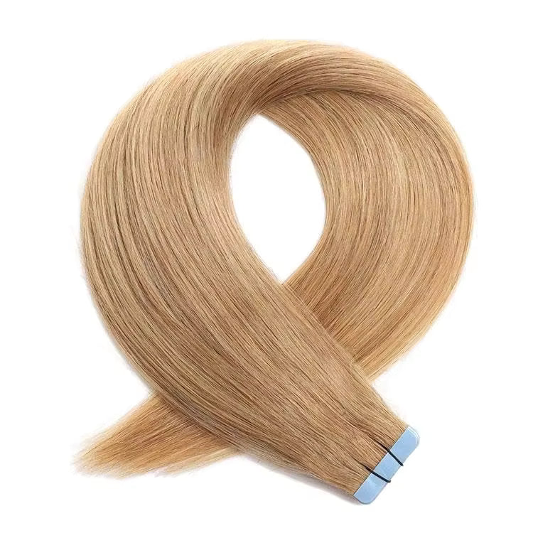 Blonde hair extensions with blue tape on a white background