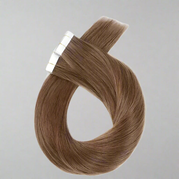 Brown hair extensions with a white background