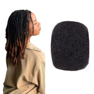 Person with braided hair next to a black foam block on a white background